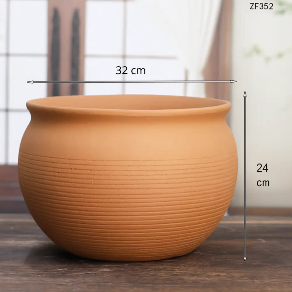 Gros pot de fleur en terre cuite