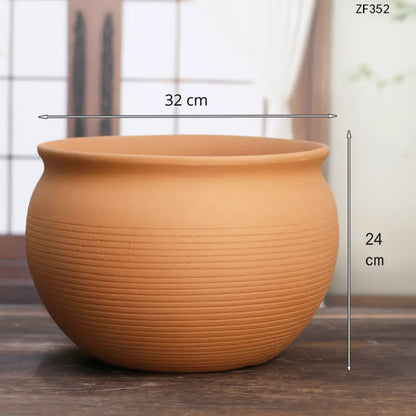 Gros pot de fleur en terre cuite