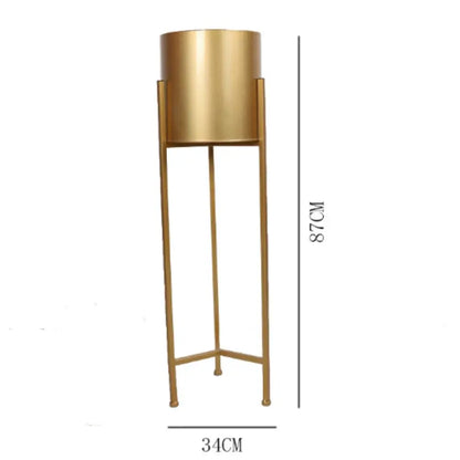 Pot de fleur doré sur pied