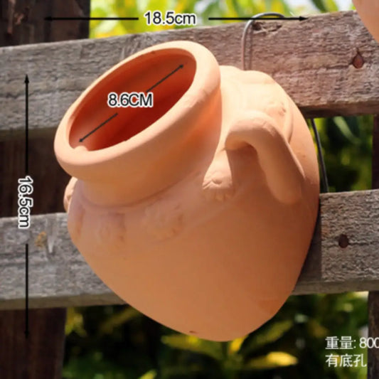 Pot de fleur mural en terre cuite