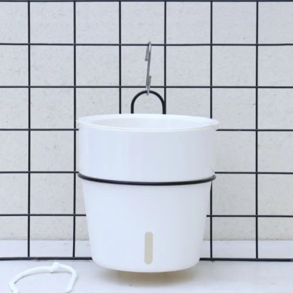 Pot de fleur suspendu avec réserve d'eau