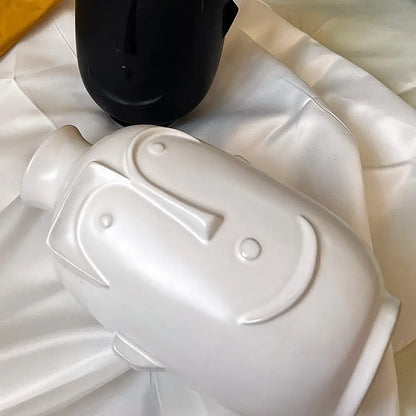Vase blanc visage