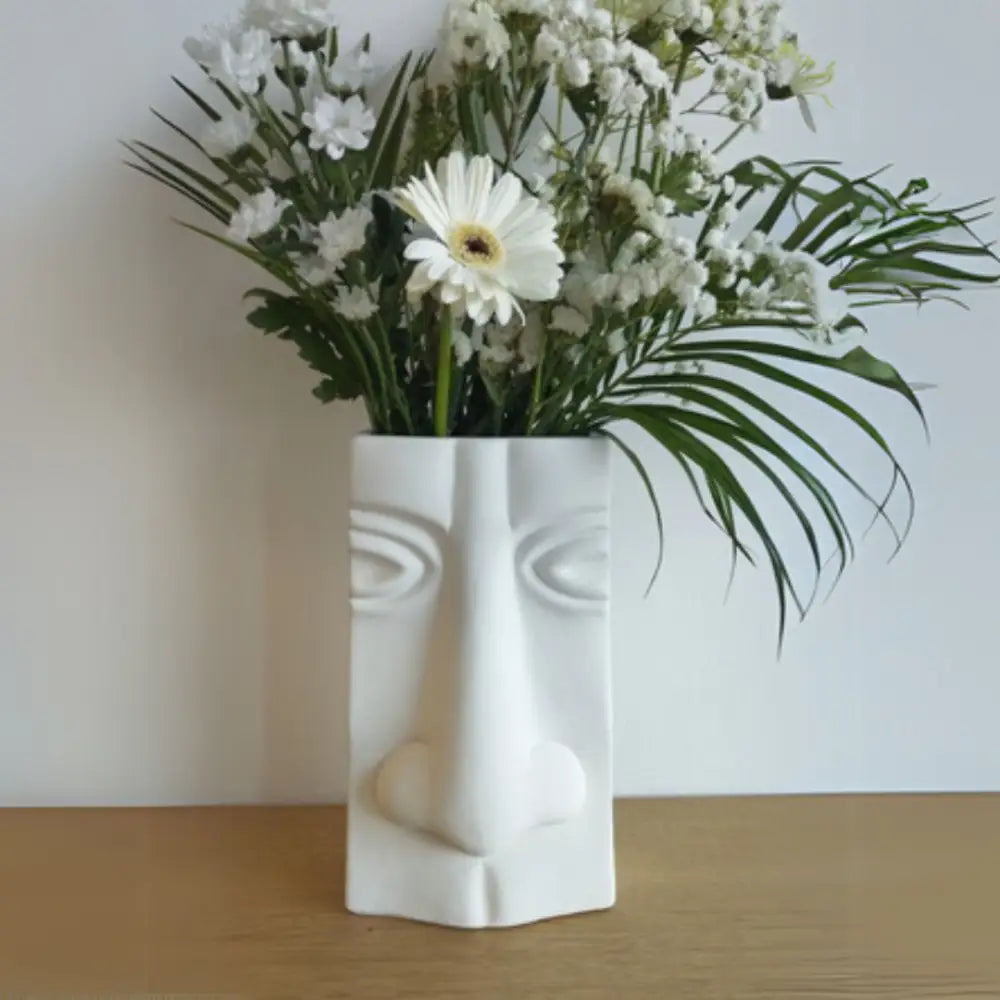 Vase visage humain